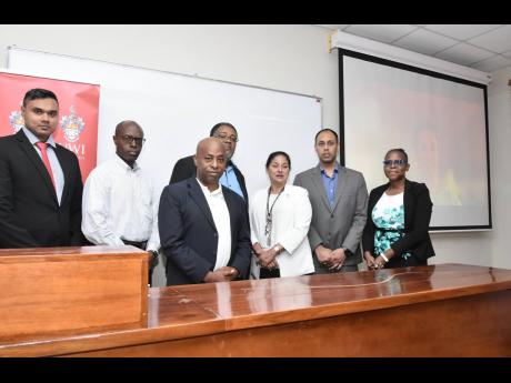 From left: Dr Curtis Boodoo, chairman for the Electric Vehicle Workgroup in CARICOM and course facilitator; David Barrett, energy and e-mobility advisor, GIZ; Orlando Hewitt, technical officer – CANTA Secretariat; Prof Michael Taylor, dean, Faculty of Sc