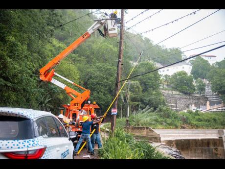 A Jamaica Public Service company team repairing powerlines damaged by Hurricane Beryl.