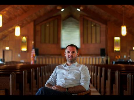 Pastor Ryan Burge, an associate professor of political science at Eastern Illinois University and author of ‘The Nones’, poses for a portrait at at First Baptist Church in Mt Vernon, Illinois on September 10, 2023. 