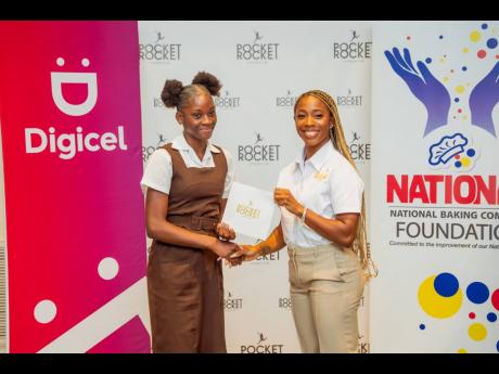 Olympic Champion and founder of the Pocket Rocket Foundation, Shelly-Ann Fraser-Pryce (right), presents a certificate to 2023-2024 scholar Nickayla Russell, Holmwood Technical High School student, during the scholarship ceremony last year. The 2024-2025 sc