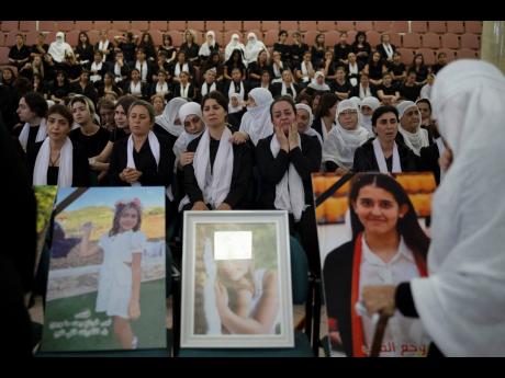 Members of the Druze minority attend a memorial ceremony on Monday, July 29, for the children and teens killed in a rocket strike at a soccer field over the weekend in the village of Majdal Shams, in the Israeli-annexed Golan Heights. 