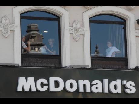 People eat at a McDonald’s restaurant in Lille, northern France.