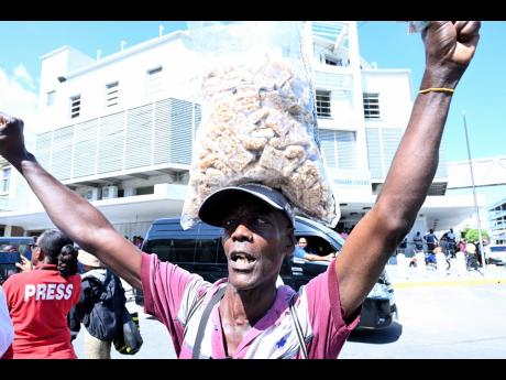 Fans of Vybz Kartel celebrating in downtown Kingston following the Court of Appeal’s ruling which freed the dancehall star yesterday. 