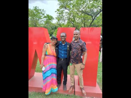 Rashaun Stewart (centre) and his parents, Tasawn Stewart (left) and Christopher Stewart, after his pinning ceremony recently at The University of the West Indies, Mona campus. 