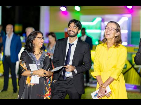 Judith Slater, British High Commissioner to Jamaica, and guests enjoy the festivities at the Independence Reception held last week at King’s House. 