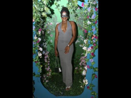 
Chavauntae Wilson, co-owner of The Fairy Loft Med Spa, dazzles in grey tones with silver accents.