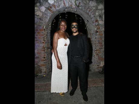 Embodying the perfect blend of allure and mystery, Denise Campbell and Mateo Askaripour pause for a photo op.