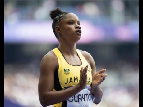 Tia Clayton of Jamaica reacts after placing second in heat 4 of the women’s 100m qualifiers at the Stade de France in Paris, France, on Friday.