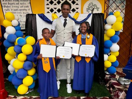 Randy Griffiths, founder of Pencils4Kids, poses with Quickstep Primary School 2024 valedictorians Jiovanni Blackwood and Cataleya Grey at the recent graduation at the St Elizabeth institution. 