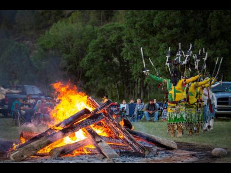 
Apache Crown Dancers begin the coming-of-age blessing ceremony for two young tribe women in Mescalero, New Mexico, on July 13.