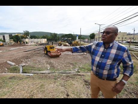 
Fitzgerald Mitchell, CEO of the University Hospital of the West Indies, shows a section of the hospital compound where work has begun under a multibillion-dollar expansion project.