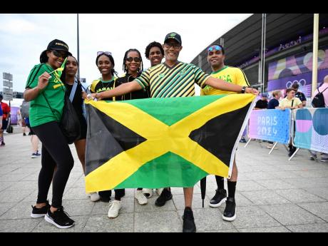 Jamaican Track and field fans arrive at the Stade de France in Paris, France, yesterday.