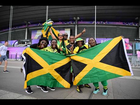 Jamaican Track and field fans arrive at the Stade de France in Paris, France, yesterday.