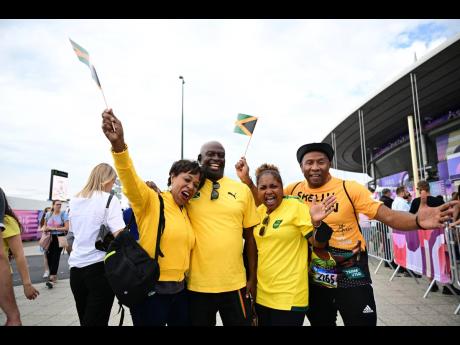 From left: Jackie James, Brian James, Jewel Parker and Chris Parker arrive at the Stade de France in Paris, France yesterday.