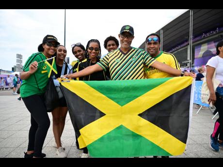 Jamaican Track and field fans arrive at the Stade de France in Paris, France yesterday.