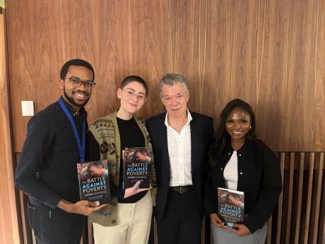 David Salmon and classmates Joyce Dzide-Tei and Ila Axelrod with former Colombian President Juan Manuel Santos.