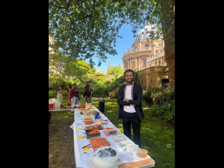 David Salmon organising Exeter College MCR Potluck.