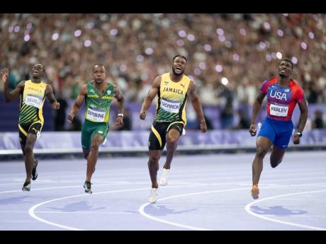 From left: Oblique Seville, Akani Simbine, Kishane Thompson and Fred Kerley dash to the finish line in the mens 100m finals.