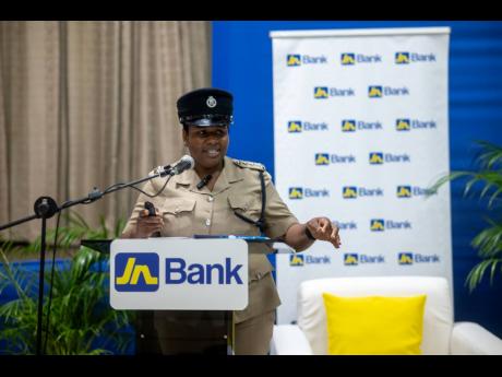 Deputy Superintendent of Police Rochelle McGibbon-Scott makes a presentation to the members during the meeting.