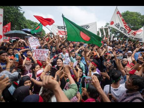 Activists take part in a protest march against Prime Minister Sheikh Hasina and her government to demand justice for more than 200 people killed in last month’s violent demonstrations, in Dhaka, Bangladesh, on Friday, August 2.