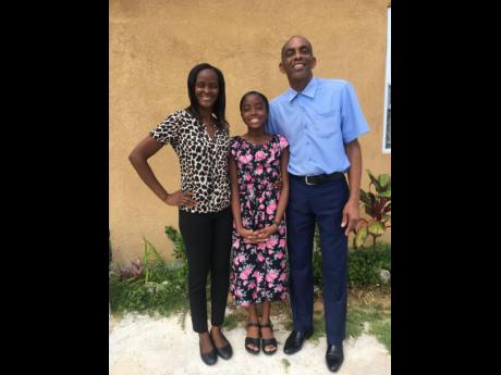 Desandra and her parents, Arlene Reid-Clarke and Desmond Clarke. Contributed Photos