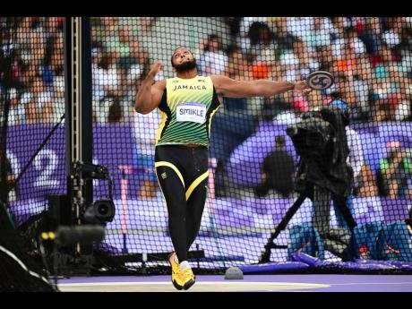 Traves Smikle, of Jamaica, competing in the men’s discus throw qualification round group at the Stade de France in Paris, France, yesterday. 