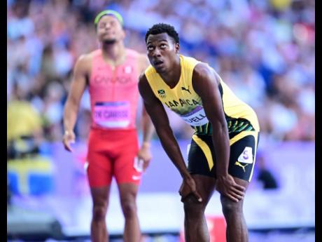 Jamaica’s Bryan Levell looks at the display board after heat 6 of  the men’s 200m at the Stade de France in Paris yesterday. Levell did not qualify automatically for the semifinals and will compete in the 200m repechage today.