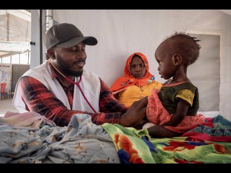 Sudanese children suffering from malnutrition are treated at an MSF clinic in Metche Camp, Chad, near the Sudanese border, on April 6. Families in Sudan’s embattled western region of Darfur finally received an emergency scale-up of food aid and nutrition