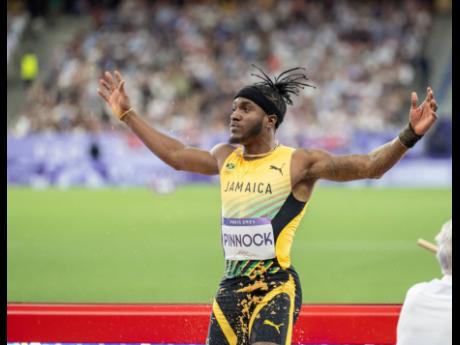 Jamaica’s Wayne Pinnock celebrates winning silver in the men’s long jump finals on Day 6 of the Paris 2024 Olympics at the Stade de France in Paris on Tuesday as his homeland celebrated Independence Day.