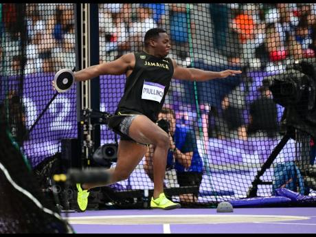 Ralford Mullings of Jamaica competes in the men’s discus throw qualification round at the Stade de France in Paris, France, on Monday, August 5.