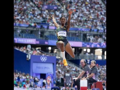 Jamaica’s Ackelia Smith competes in the women’s long jump qualifications at the Stade de France in Paris, Saint-Denis, France, yesterday.