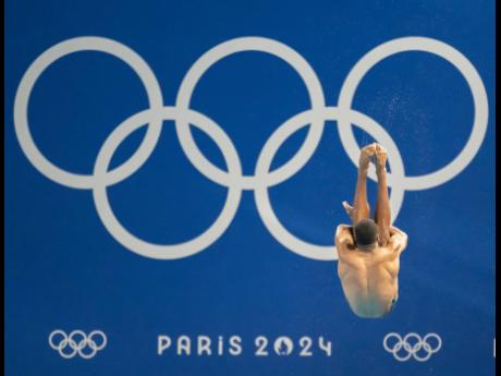 Jamaica’s Yona Knight-Wisdom competing in the men’s three-metre springboard diving competition at the Aquatic Centre in Paris Saint-Denis, France, yesterday.