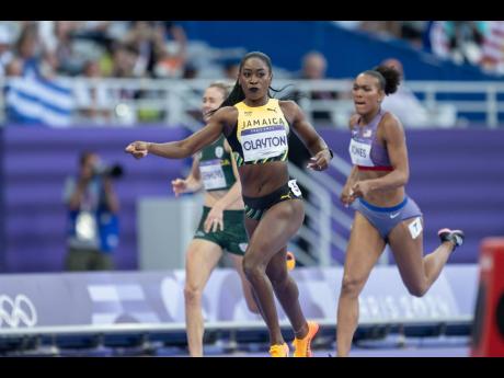 Rushell Clayton on her way to winning her women’s 400-metre hurdles semi-final heat at the Stade de France Paris, France, yesterday.