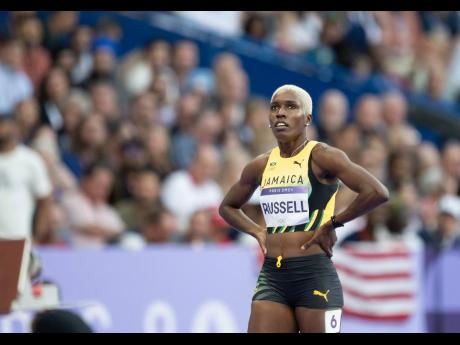 Jhanieve Russell looks disappointingly at the monitor after her fourth-place finish in the women’s 400-metre hurdles semi-final at the Stade de France, in Paris, France, yesterday. 