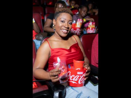 Lights, camera, action! Sheakera James smiles for the camera as she awaits the start of the movie.