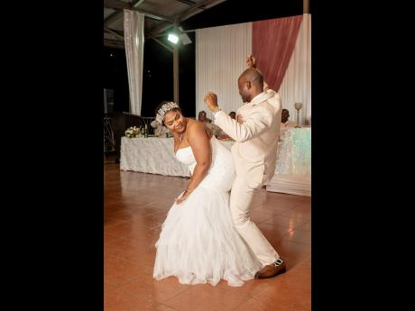 Pedrine and Kenroy enjoy a festive dance as husband and wife.