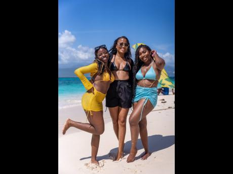 From left: Nneka Edwards, Jhoni Wright and Arianne Logan enjoyed a ‘girls day at the cay’ last Saturday.