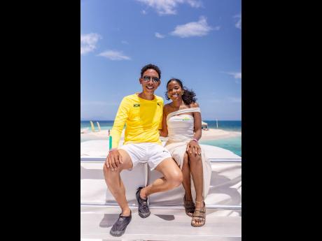 David Martin, vice-president of business consulting, Pan Jamaica Group, and Candise Bulli, brand manager, St Mary’s Tropical Snacks, catch some rays while onboard the Loose Cannon catamaran for the St Mary’s Cheese ‘N’ Seas experience. 