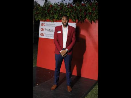 Newly minted general manager for GK Capital Management, Kareem Tomlinson, dons the company’s red for the event. 