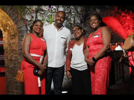 From left: Terry-Ann Graver, First Global Bank’s chief operating officer, joins Steven Whittingham, Grace Burnett and Margaret Campbell, chief operating officer of the GraceKennedy Financial Group, for a quick photo. 