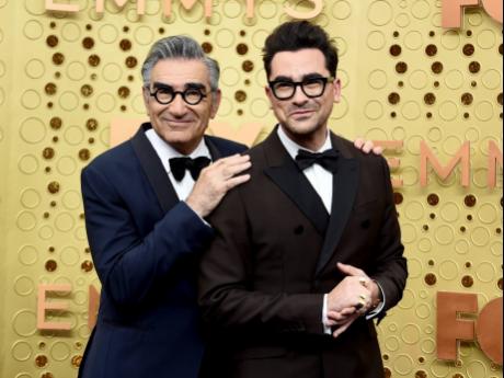 Eugene Levy (left) and his son, Dan, will be the first-ever father-son hosts at the Emmys and the first duo to co-host since 2018.