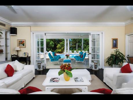 The inviting, elegant living room opens out to the terrace, pool and so much more.