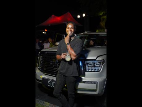 Content creator and mariner, Danar ‘Dan Dan’ Royal, gives a radiant smile as he poses by the newly launched GWM Tank 500.