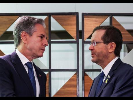 US Secretary of State Antony Blinken (left), meets with Israel’s President Isaac Herzog, in Tel Aviv, Israel yesterday.