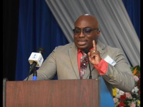 Leighton Johnson, outgoing president of the Jamaica Teachers’ Association (JTA), addressing the opening ceremony of the organisation’s 60th Annual Conference in Trelawny on Monday.