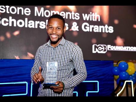 John-Ross Crooks, one of two National Commercial Bank (NCB) Foundation scholarship recipients for 2024, celebrates his success at the Foundation’s Sweet 16 anniversary event held at AC Hotel on Thursday. 