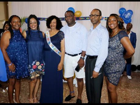 Salome Ogilvie shares the spotlight with her children (from left) Sandra Ogilvie Thomas, Judith Ogilvie, Andrew Ogilvie, Clive Ogilvie and Celia Ogilvie at a special party celebrating her 80th birthday at Sea Garden beach resort in Montego Bay on August 10