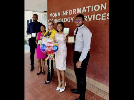 Janice Brown, manager of user support services at Mona Information Technology Services, UWI, Mona, and initiative owner of PIKE, is flanked by interns (from left) Richard Barnett, Selena Babolal, Michaela Powell and Nackeemi Smith.