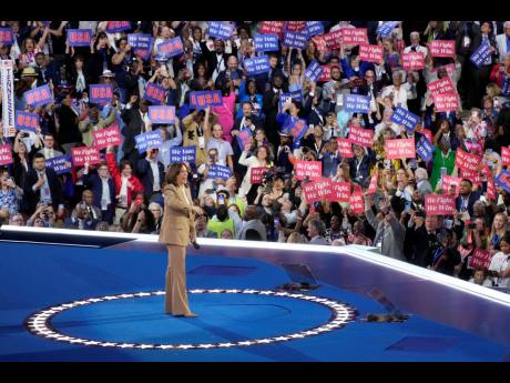 Democratic presidential nominee Vice President Kamala Harris speaks during the Democratic National Convention on Monday in Chicago to a strong show of support from a packed room.