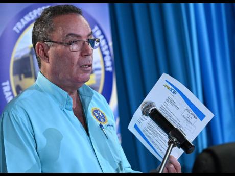 Daryl Vaz, ministry of science, energy, telecommunications and transport, addresses the media during a press conference on recent developments concerning the Jamaica Public Service Company and electricity bills, as well as the regulatory efforts of the Off